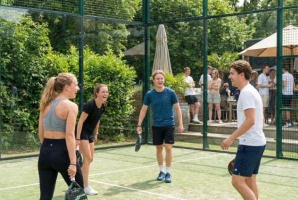 young people playing padel at resort