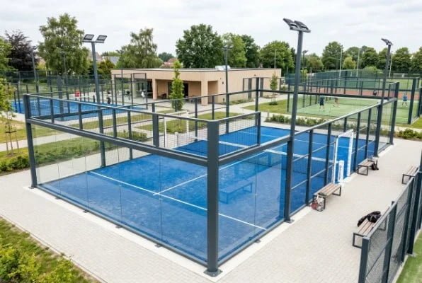 Modern outdoor padel court installation with blue artificial turf