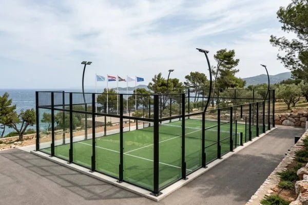 Classic outdoor padel court with supported perimeter frame